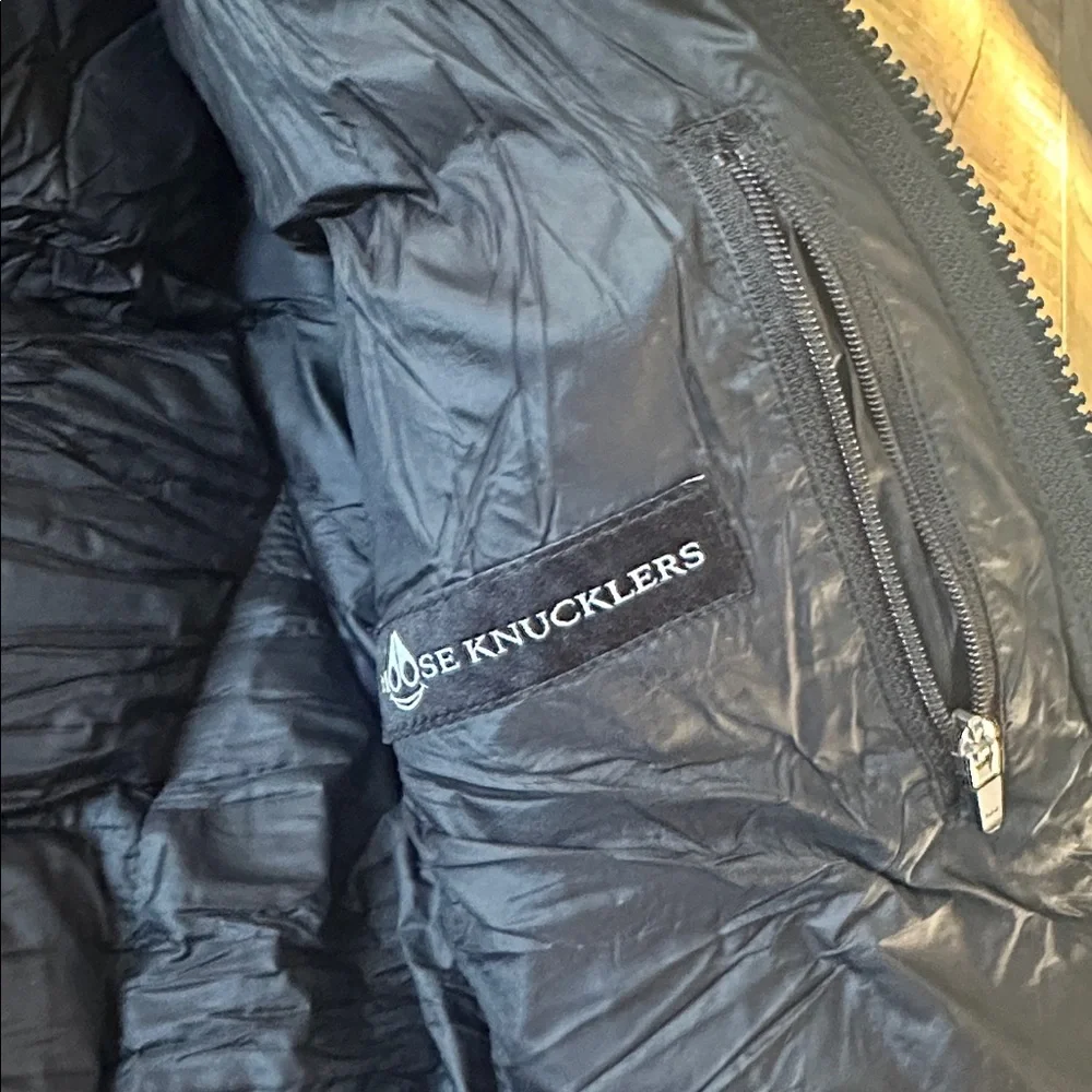 Moose Knuckles black hooded puffer with hologram imprint logo size small